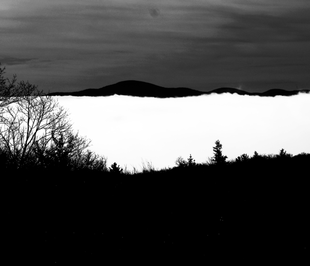 Hills above foggy horizon, B & W
